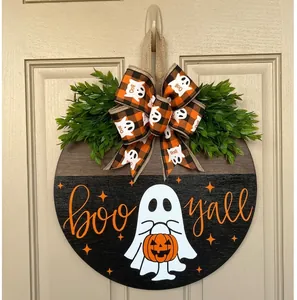 Detail of wooden Halloween door hanger with ghost pattern and 'BOO Y'ALL' text art