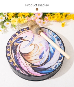 Close-up of decorative steel drum featuring an artistic blue phoenix illustration