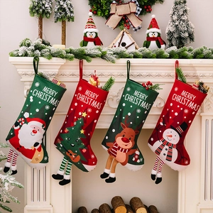 Detail of 4-piece Christmas stocking set with Santa and snowman on a white fireplace