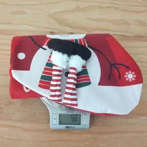 Detailed view of striped hanging legs on a Christmas ornament weighing 50.3 grams