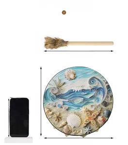 Macro detail of ocean shell hand drum with 10 inch diameter and matching mallet