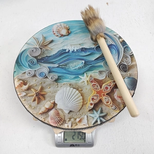 Detail of a lightweight 215g ocean-themed shaman drum with starfish patterns and a mallet