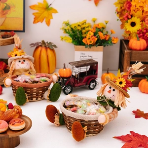 Close-up of harvest festival scarecrow candy baskets with colorful autumn treats