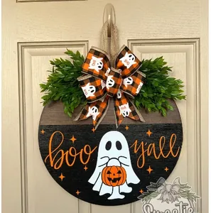 Close-up of Halloween wooden door sign featuring white ghost and Boo Y'all lettering