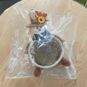 Thanksgiving scarecrow candy basket inside transparent protective plastic packaging