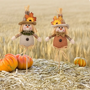 Harvest boy and girl scarecrow stakes with sunflowers and pumpkins for autumn home decor