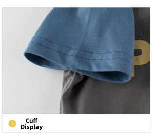 Close-up of the contrasting blue cuff and yellow letter P detail on a grey cotton T-shirt