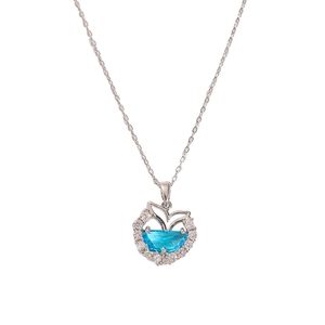 Silver fishtail necklace with crescent blue stone and sparkling zircon halo