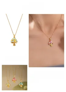 Detail view of colorful enamel mushroom pendant necklaces with gold chain in four grid display