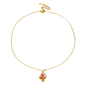 Polished gold mushroom pendant necklace with colorful polka dot enamel on white background