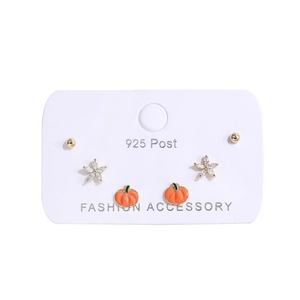 Detail of 925 silver post earrings set with zircon flower and orange pumpkin charms