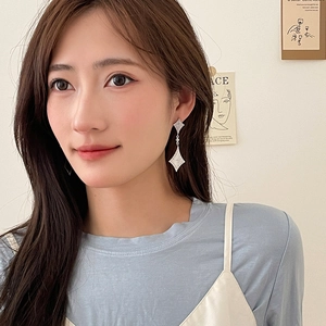 Brushed silver double rhombus drop earrings shown worn for a chic textured look