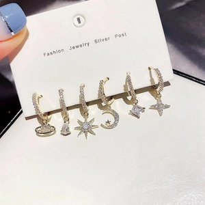 Detail of 6-piece gold-plated star and moon earring set with cubic zirconia pave