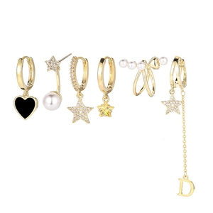 Detail of 6-piece gold earring set featuring stars, pearls, heart, and fringe tassels