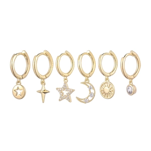 Detailed set of six gold-plated hoop earrings with star and moon charms and zircons