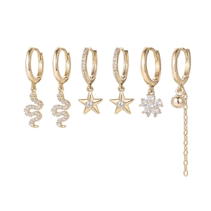 Detail view of a 6-piece gold hoop earring set with zircon-encrusted stars and snakes