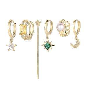 Detail of 6-piece gold earring set featuring star moon charms and colorful zircon stones