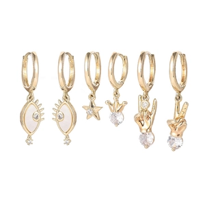 Golden 6-piece earring set featuring moon, star, evil eye and shell charms