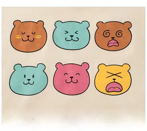 Detail of soft cotton fabric showing six colorful cartoon bear faces with playful expressions