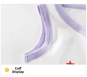 Macro detail of white cotton toddler tank top cuff with purple trim and red star print