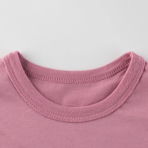 Pink cotton round neck T-shirt for toddlers showing ribbed neckline and stitching detail