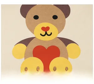 Close-up of the cartoon bear print with heart detail on beige cotton t-shirt fabric