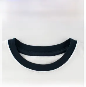 Detail view of the ribbed crew neckline with navy blue contrast stitching on white cotton T-shirt