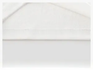 Detail view of the white cotton T-shirt hem featuring double-needle flatlock stitching