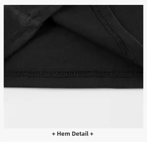Detailed close-up showing the hemline with neat double-needle stitching on a black cotton T-shirt