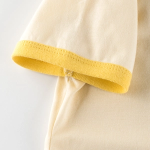 Short sleeve cotton T-shirt for kids featuring a yellow ribbed cuff detail and soft fabric