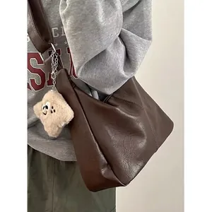 Vintage dark brown PU leather tote bag with plush charm on wide shoulder strap