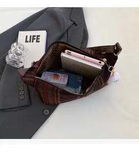 Internal view of the vintage plaid tote showing spacious storage for books and accessories