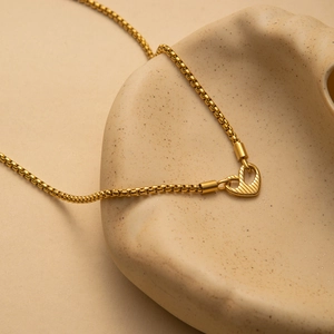 Golden stainless steel heart pendant necklace with textured I AM WORTHY engraving