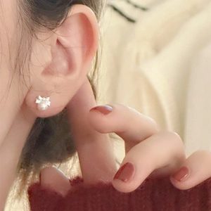 Elegant bow-knot pearl stud earrings for women with silver metal and white pearl detail