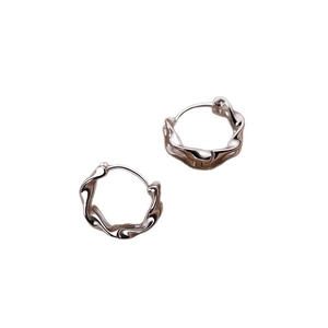 Double layered Mobius hoop earrings with a twisted lava texture in minimalist silver