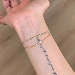 Gold-plated stacked bracelet set with turquoise stones and white clover charm