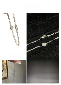 Detailed view of silver heart pendant bracelet with shimmering cubic zirconia and lobster clasp