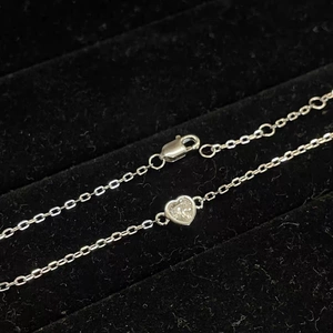 Elegant silver heart pendant necklace with sparkling crystal in a black velvet jewelry box