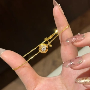 Eleganter Goldarmband mit schwebender Kugel, Mikro-Pavé-Diamanten und funkelndem Stein