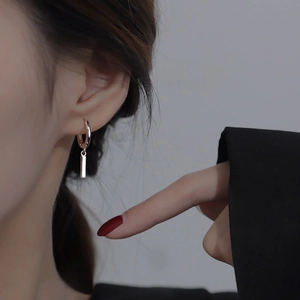 Sleek silver rectangular bar pendant earrings on model for a minimalist jewelry look