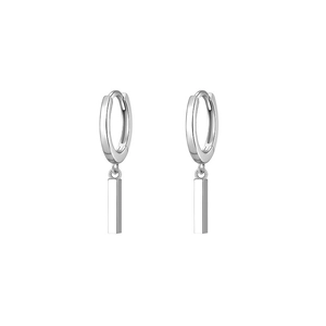 Macro view of minimalist silver bar pendant earrings in polished geometric drop style