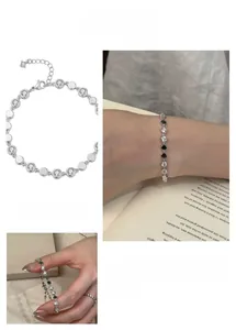 Detail of vintage silver round diamond bracelet with polished discs and lobster clasp