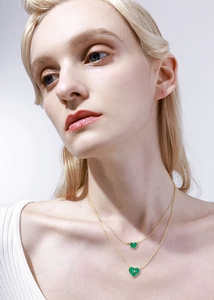 Close-up of double-layer S925 silver necklace with green heart-shaped malachite pendants