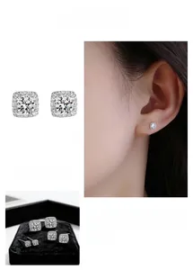 Macro shot of silver geometric square stud earrings with pave-set shimmering crystals