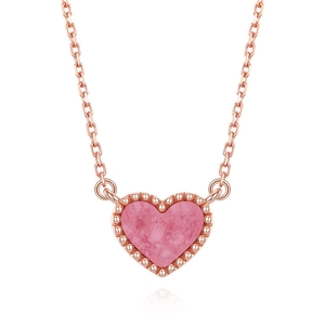 Detail of S925 silver heart necklace with pink shell inlay and rose gold finish