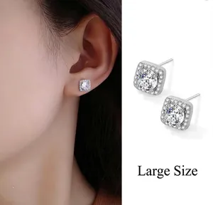Detail of large square halo stud earrings with micro-pave crystals on model