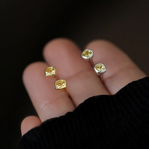 Elegant gold and silver square-cut yellow gemstone rings with minimalist settings
