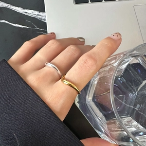 Minimalist irregular wavy gold and silver rings for women with smooth metallic finish