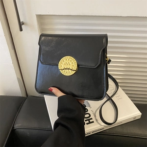 Classic black vintage leather shoulder bag featuring a retro gold textured metal buckle