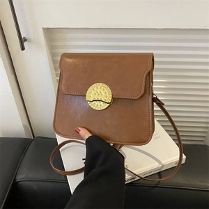 Chic brown retro square leather crossbody bag with a hammered gold metal buckle decoration